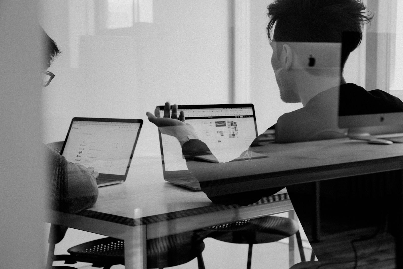 Data engineers in a working session reviewing pipeline architecture